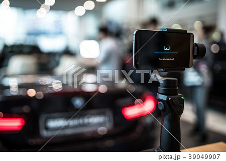 Gimbal camera in action with sport car on back 39049907