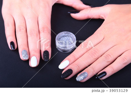 Black, white Nail art manicure. Holiday style Black, white Nail art manicure. Holiday style 39053129