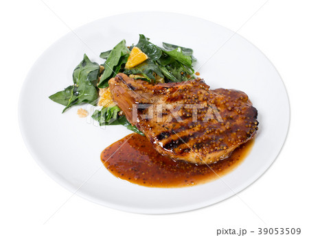 Grilled pork fillet with spinach salad. Grilled pork fillet with spinach salad. 39053509