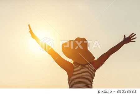 happy woman enjoying freedom with open hands on sea 39053833