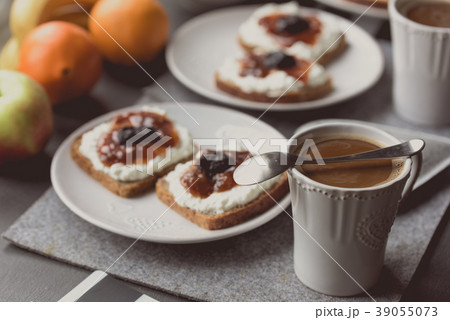 Breakfast with dark bread, white cheese and jam 39055073