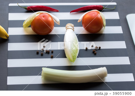 Vegetables happy face smiling on the kitchen table 39055900