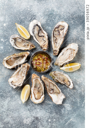 Fresh oysters on stone table 39056972