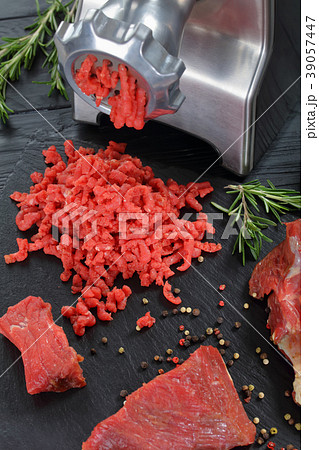 mincer is making fresh beef forcemeat 39057447