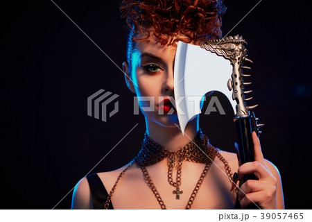 Close up of confident warrior girl keeping sharp 39057465