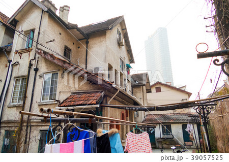 Old buildings coexist with modern skyscrapers in Old buildings coexist with modern skyscrapers in 39057525