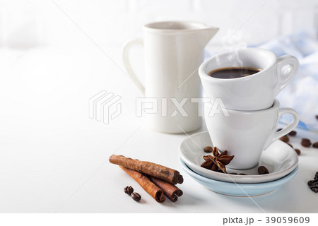 Coffee cup and beans on a white background. 39059609