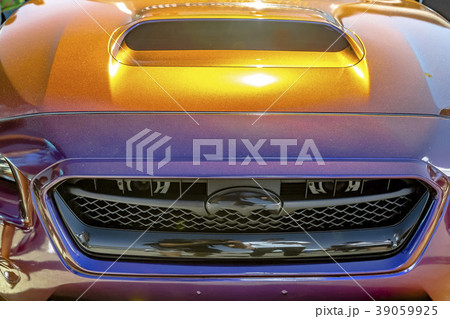 Front hood and closup of orange reflective car Front hood and closup of orange reflective car 39059925