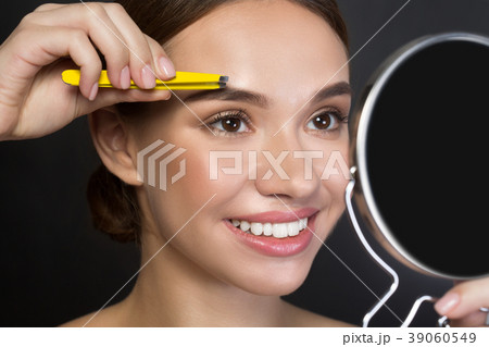 Cheerful attractive girl is holding pincers 39060549