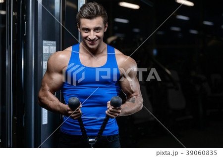 Handsome model young man workout in gym Handsome model young man workout in gym 39060835