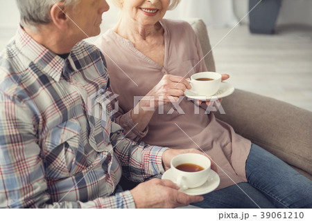 Old wife and husband enjoying morning beverage 39061210