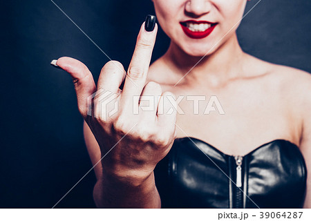 A woman shows an indecent gesture - middle finger A woman shows an indecent gesture - middle finger 39064287
