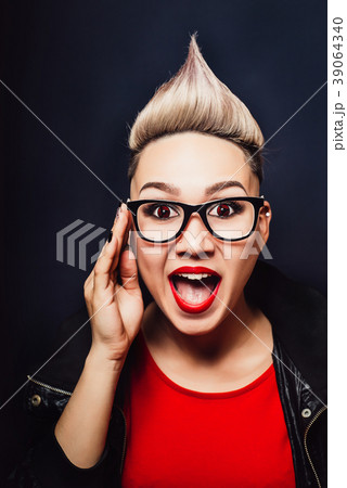 Woman with glasses expresses surprise happiness Woman with glasses expresses surprise happiness 39064340