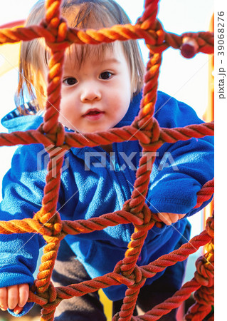 Toddler boy playing at the playground Toddler boy playing at the playground 39068276