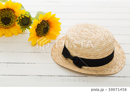 Straw hat sunflower decoration hi-res stock photography and images