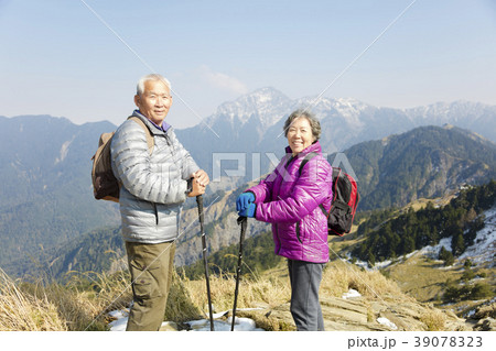 happy senior couple hiking on the mountain happy senior couple hiking on the mountain 39078323