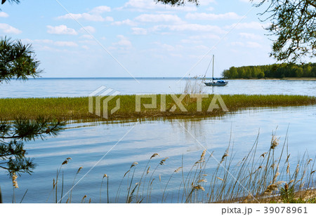 a lone yacht on the horizon 39078961