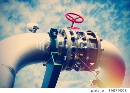 Steel pipelines and valves against blue sky 39079308
