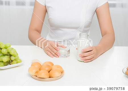 Women prepare some bread for breakfast Women prepare some bread for breakfast 39079758
