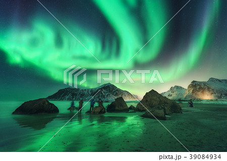Green aurora borealis and people. Northern lights 39084934