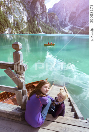 girl backpacker looking at Braies lake girl backpacker looking at Braies lake 39088175