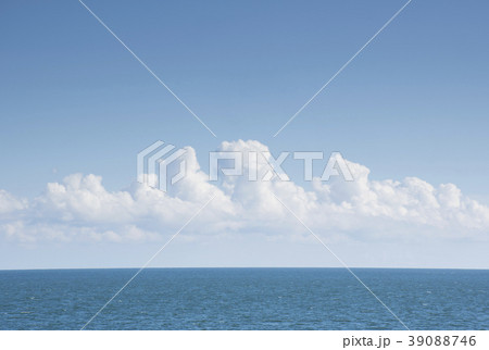 White cumulus clouds above blue Atlantic Ocean 39088746