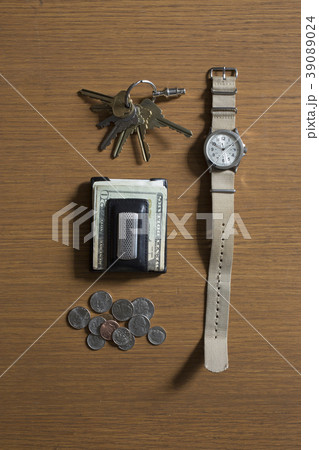 Watch, keys and money on table Watch, keys and money on table 39089024