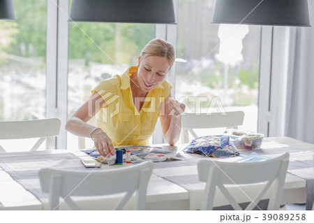 Woman making quilt Woman making quilt 39089258