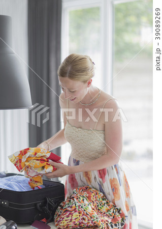 Woman packing suitcase 39089269