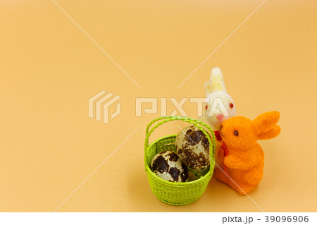 Easter bunnies and basket with eggs Easter bunnies and basket with eggs 39096906