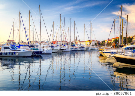 Harbor with docked boats in Porec town. Harbor with docked boats in Porec town. 39097961
