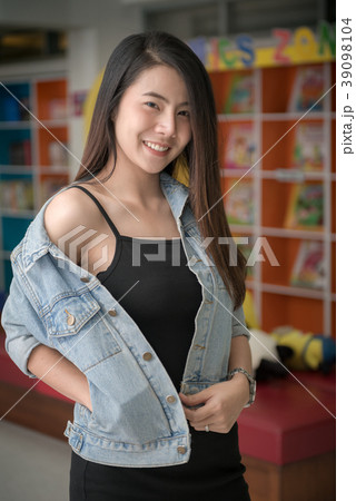 cute young asian woman in jacket jeans smile  39098104