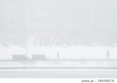 People walking in extreme fog 39098878
