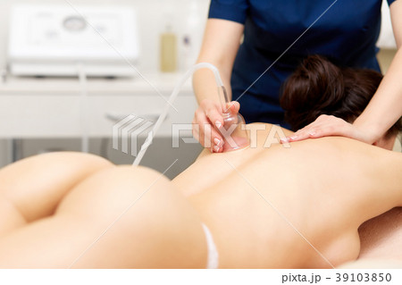 Sexy woman getting vacuum therapy procedure on her Sexy woman getting vacuum therapy procedure on her 39103850