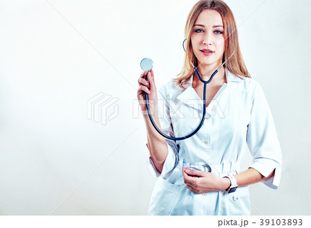 Close up of a nurse in front of bright background Close up of a nurse in front of bright background 39103893