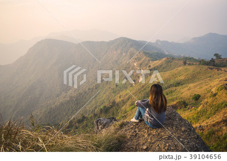 woman traveler looking at beautiful landscape woman traveler looking at beautiful landscape 39104656