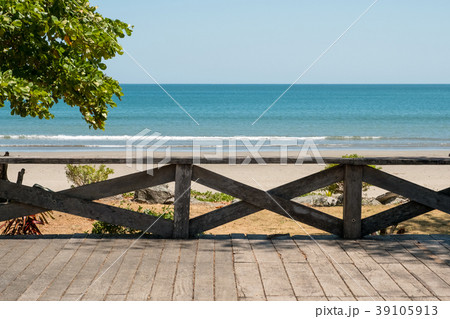 wooden terrace with beach, ocean and blue sky   39105913