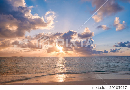 sunset sky , colorful clouds over ocean and beach 39105917