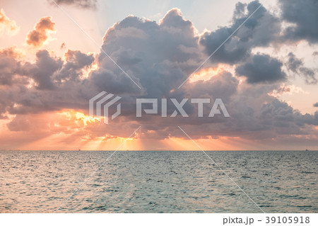 dramatic sky  sunset over water  scenic cloudscape 39105918