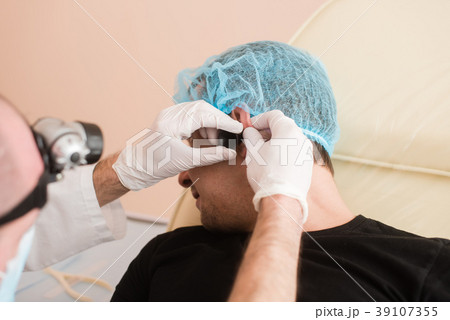 Doctor checkup patient ear Doctor checkup patient ear 39107355