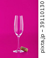 Wine glass with cork on pink 39110130