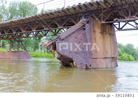 old iron bridge over the river Ufa with the broken 39110851