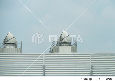 Cooling towers on daylight on the factory roof 39111896