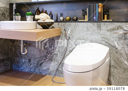 bathroom with bright tiles with toilet and sink bathroom with bright tiles with toilet and sink 39118078