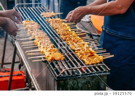 Grilled BBQ pork satay skewers on charcoal stove Grilled BBQ pork satay skewers on charcoal stove 39125570