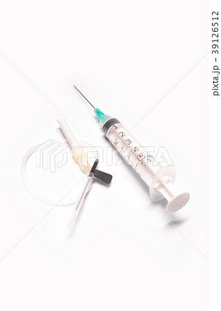Medical syringe closeup with catheter on white bac Medical syringe closeup with catheter on white bac 39126512