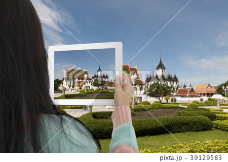 Tourist girl taking photo of Thailand landmark. 39129583