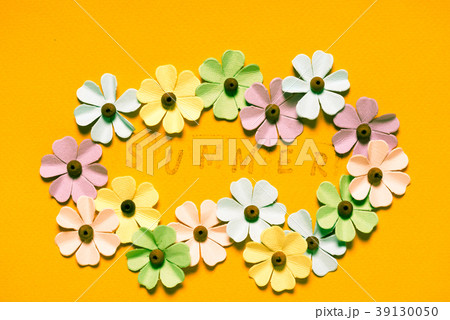 paper flowers on yellow background paper flowers on yellow background 39130050