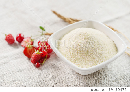 Raw unprepared semolina in bowl 39130475