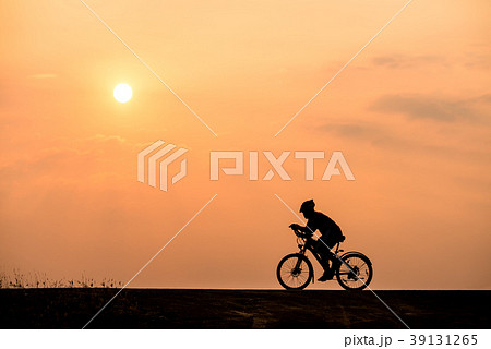 Silhouette of cyclist on sunset background Silhouette of cyclist on sunset background 39131265